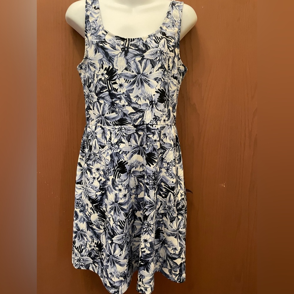 H & M blue cotton Sun dress on a white background.  Criss Cross straps on back.